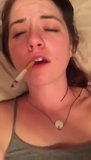 Курящая брюнетка доводит себя до оргазма snapshot 2