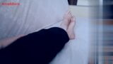 For comfort, Anna sits barefoot on the sofa - 1 snapshot 1