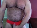 Muscular man on red speedos snapshot 11