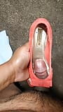 mechanic playing with pink open toe American Eagle heels snapshot 4