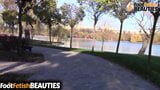 Barefoot brunette teases everyone in a public city park snapshot 2