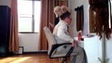 Nudist barbershop. Nude lady hairdresser in an apron. camera. The client is surprised. short 1 snapshot 3