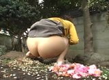 Japanese girl farting in the garden snapshot 8