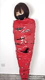 NANA Mummified with red plastic tape and then played with for orgasms snapshot 3