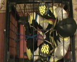 Yellow and black - the bikerslave gets a massage in the cage snapshot 4