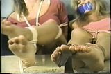 Girls struggle feet tied to table snapshot 12