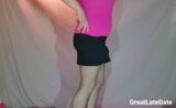 Bulging Under a Mini Skirt in Pantyhose wearing a Tiny Shiny Spandex Thong - Crossdresser having fun showing His bulge snapshot 2