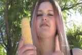 Girl with corn cob snapshot 2