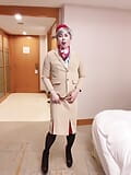 Asian sissy dancing and striping in Emirates cabin crew uniform snapshot 1