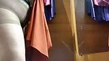 Curvy MILF in the mall fitting room trying on skirts snapshot 1