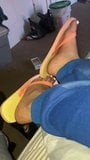 Ebony feet in colorful flip flops snapshot 2