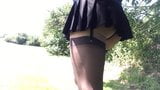 pleated black school skirt walk in public . snapshot 13