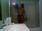 Girl in glass taking a shower snapshot 11