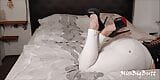 BWB MissBigButt wearing her high heel collection with white freddy leather pants and black latex corsage in bed snapshot 4