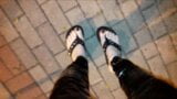 crossdresser on a public street in latex leggings and sexy platform flip flops snapshot 2