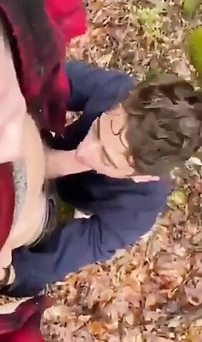 Friend blows his buddy after class in the woods