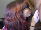 Hot Young girl with glasses licking a big cock snapshot 1