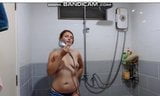 Milf stripping and showering. snapshot 5