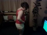 Stripping off girdle and stockings snapshot 3