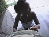 Ebony chick giving outside head snapshot 1