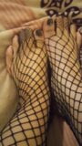 Unpedicured feet in fishnets snapshot 3