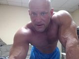 Bald bodybuilder flex, work out, and jerk off snapshot 3