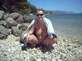 Busty Blond Milf pissing at the beach snapshot 4