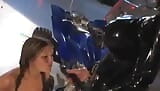 Latex Mistress pegging slave girl in aiport hall. snapshot 11