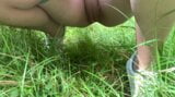 Une salope rousse pisse et branle sa chatte dans la forêt snapshot 5