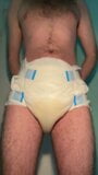 Diaper boy is peeing in a fresh diaper snapshot 6