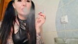 Dominatrix Nika smokes.  Smoking fetish.  Cigarette smoke from the mouth of a charming Mistress right on your face. snapshot 10