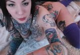 Tatooed chick with massive boobs snapshot 2