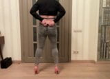 Femboy in grey skinny back zipper jeans, high heels and black cropped blouse dancing masturbating and cum snapshot 3