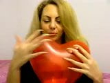 margoo popping balloons with his huge pointed nails snapshot 5