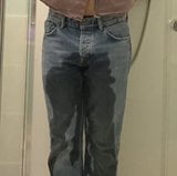 Guy pees in jeans snapshot 4