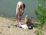 A couple of young nudists are spied on while having sex and snapshot 19