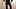 Nicki-Crossdress в сексуальном черном мини-платье, колготках и сапогах