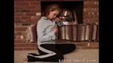 Little April with natural tits fingering beside fire place snapshot 1