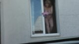 Neighbor taxi driver from looks at neighbor MILF who washes window of apartment naked. Nude in public snapshot 13