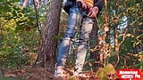 Guy pissing in the forest under a tree snapshot 2