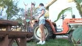 Beautiful brunette farmer girl masturbating on tractor snapshot 2