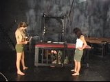 Three lesbians in torture chamber strip and one bends over for spanking snapshot 7