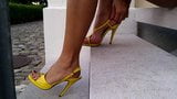 6 Putting on yellow strappy high heel sandals & zooming in. snapshot 4