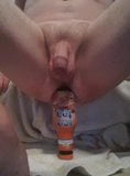 Squatting on and fucking ice tea bottle. Male insertion. snapshot 2