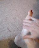 Rubbing lotion on my foot snapshot 2