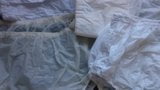 Diaper and Lots of White Plastic Pants. snapshot 8