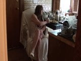 Housewife. Lady in white. On the kitchen-02 snapshot 2