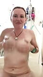 Massaging mommy's lathered up titties in the bath snapshot 3