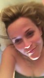 Reese Witherspoon laying on her bed, selfie vid snapshot 4
