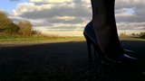 Walking in black patent hells fishnets and black tight skirt snapshot 2